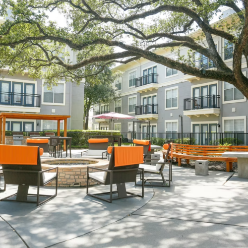 Single-story board-and-batten homes with covered porches and landscaped walkways